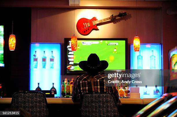 Black Hawk resident, Mike Keeler, plays a slot machine at the Guitar Bar at the The Reserve, formally Fortune Valley Casino in Central City, Thursday...