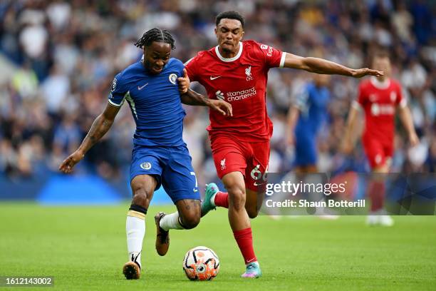 Raheem Sterling of Chelsea runs with the ball whilst under pressure from Trent Alexander-Arnold of Liverpool during the Premier League match between...