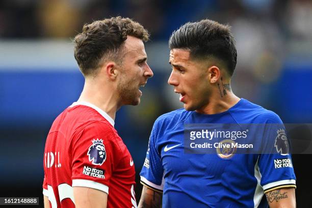 Diogo Jota of Liverpool clashes with Enzo Fernandez of Chelsea during the Premier League match between Chelsea FC and Liverpool FC at Stamford Bridge...