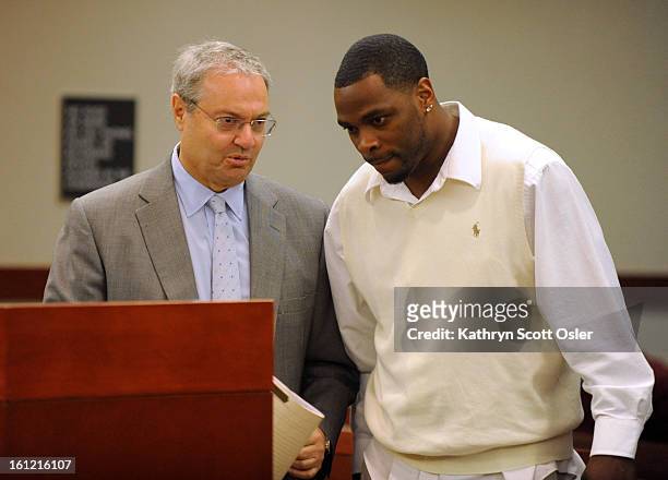 Denver Broncos cornerback Perrish Cox, right, appearing with his attorney Harvey Steinberg, pleaded not guilty this morning in Douglas County...