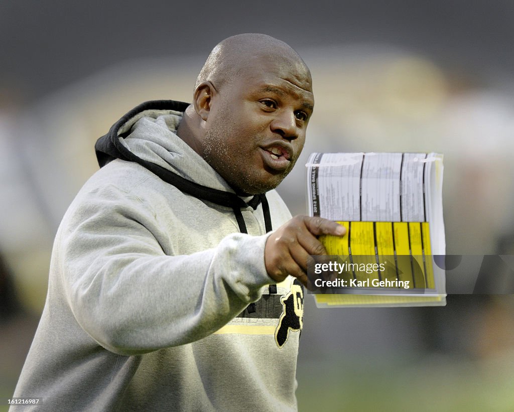 Buffs offensive coordinator Eric Bienemy made a point during practice Saturday night in Boulder. The University of Colorado football team scrimmaged Saturday night, April 14, 2012 during a practice session open to the public at Folsom Field. Karl Gehring/