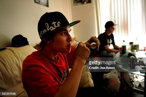 Trevor McCorkle 19 sips at his sunday dose of methadone at the Englewood apartment he shares with his younger brother Jarrod 18, Saturday, April, 14...
