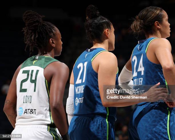 Jewell Loyd of the Seattle Storm, Kayla McBride of the Minnesota Lynx and Napheesa Collier look on during the game on August 20, 2023 at Target...