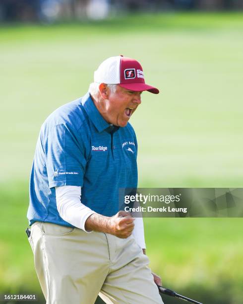 Ken Duke of United States, who finished first at -14 overall, reacts after making his final put on the final day of the Shaw Charity Classic at...