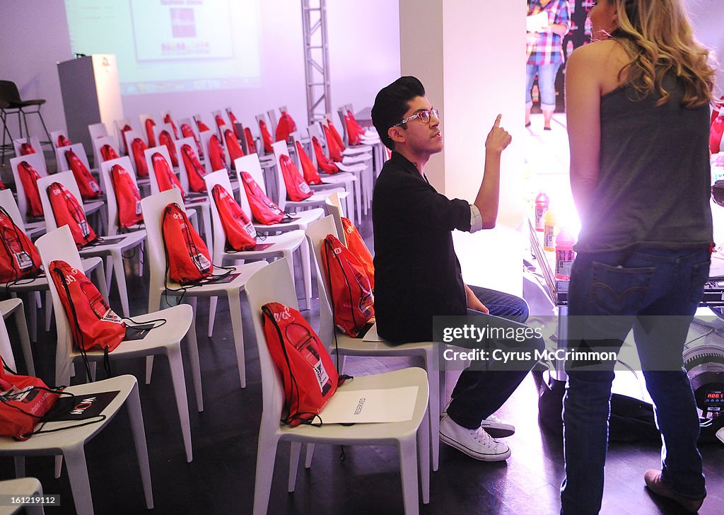 Fashion designer Mondo Guerra, of "Project Runway" fame, was a judge at Vitaminwater Fashion Show at the Museum of Contemporary Art in Denver on Wednesday, May 18, 2011. A hour before the show Guerra gets prepped on how the show will be run. Cyrus McCrimm