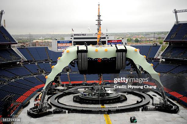 Crews are preparing the stage for the concert at Invesco Field at Mile High on Thursday. May 19, 2011. Hyoung Chang/ The Denver Post