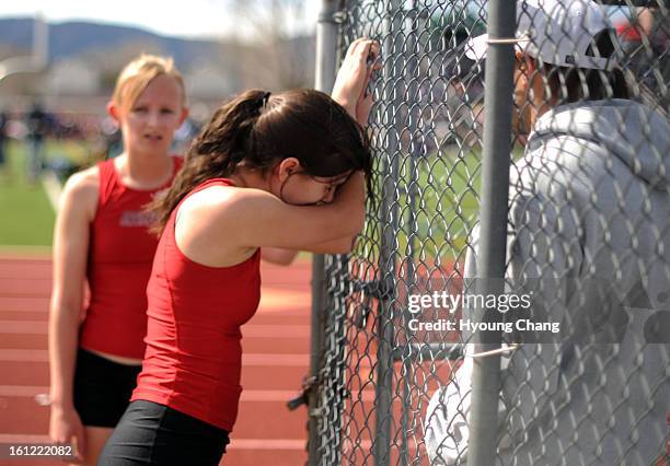 Bella Whitten of Eagle Crest is crying after finishing girls 1600m run as 14th place in Runners Roost of Fort Collins Invitational at Rocky Mountain...