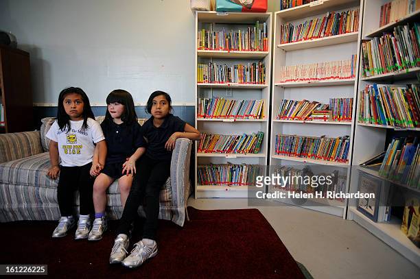 From left to right Amy Hernandez Shavonnah Paiz, 6 and Evelyn Samperio hold hands during the beginning of their afterschool program as education...