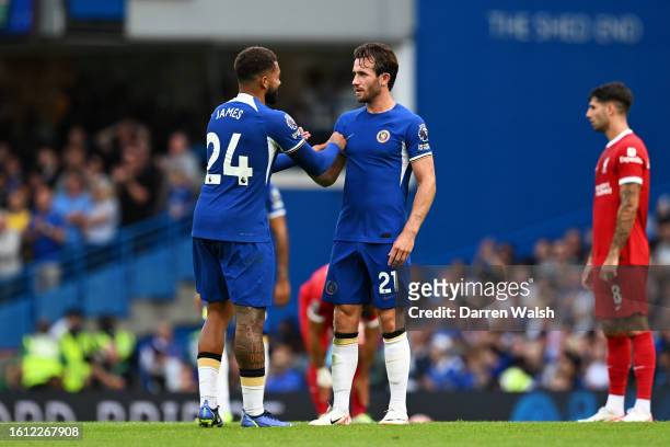 Reece James of Chelsea gives teammate Ben Chilwell the Captain's Armband following his substitution during the Premier League match between Chelsea...