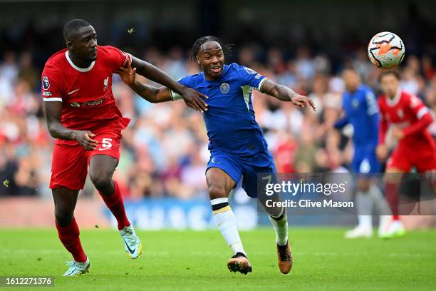 Ibrahima Konate of Liverpool and Raheem Sterling of Chelsea battle for possession during the Premier League match between Chelsea FC and Liverpool FC...