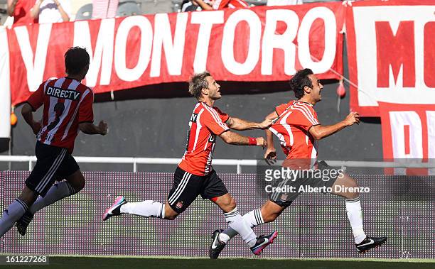 Marcos Gelabert celebrates a goal with Gaston Fernandez during a match between Estudiantes and Tigre as part of the 2013 Final Tournament on February...