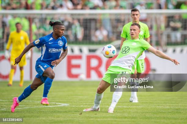 Kanto Voahariniaina of TuS Makkabi Berlin battles for possession with Yannick Gerhardt of VfL Wolfsburg during the DFB cup first round match between...