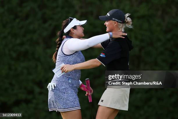 Lilia Vu of the United States and Charley Hull of England embrace on the 18th green on Day Four of the AIG Women's Open at Walton Heath Golf Club on...