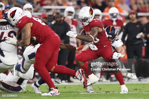 Running back Corey Clement of the Arizona Cardinals rushes the football against the Denver Broncos during the NFL game at State Farm Stadium on...