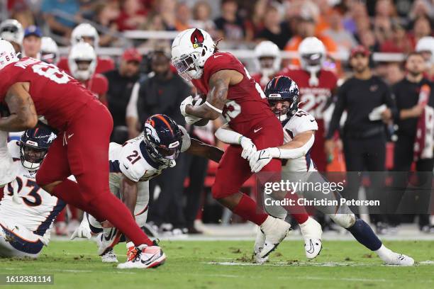 Running back Corey Clement of the Arizona Cardinals rushes the football against the Denver Broncos during the NFL game at State Farm Stadium on...