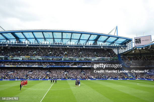 General view of the inside of the stadium as players of Chelsea and Liverpool pause for a minutes applause in memory of former Chelsea Player and...