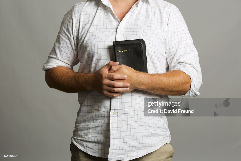 Man Holding a Bible