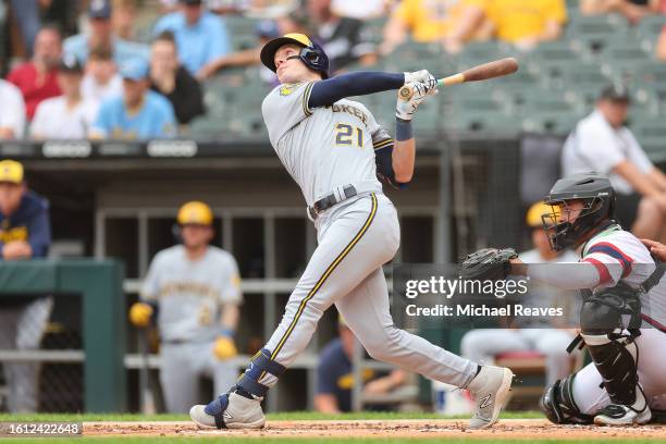 Mark Canha of the Milwaukee Brewers hits a RBI sacrifice fly against the Chicago White Sox during the second inning at Guaranteed Rate Field on...