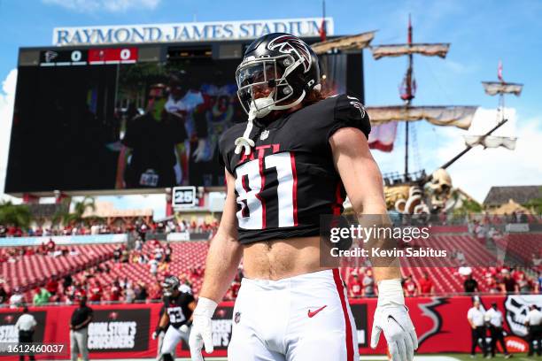 Hayden Hurst of the Atlanta Falcons stretches prior to an NFL game against the Tampa Bay Buccaneers at Raymond James Stadium on September 19, 2021 in...