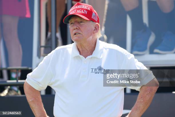 Former President Donald Trump looks on at hole one prior to the start of day three of the LIV Golf Invitational - Bedminster at Trump National Golf...