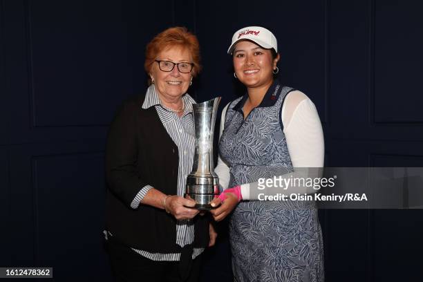 The first Women's Open Champion, Jenny Lee Smith and 2023 Champion, Lilia Vu of the United States pose with the AIG Women's Open trophy following Day...