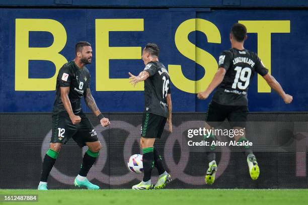 Willian Jose of Real Betis celebrates with teammates Andres Guardado and Luiz Felipe after scoring the team's second goal during the LaLiga EA Sports...