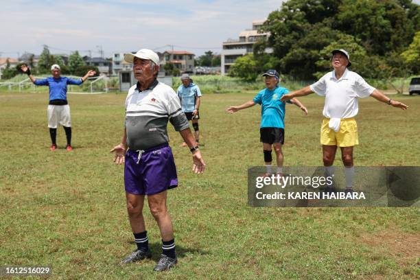 This photo taken on June 28, 2023 shows 85 year old rugby player Yasutake Oshima taking part in a rugby training session for his senior-over-70s...