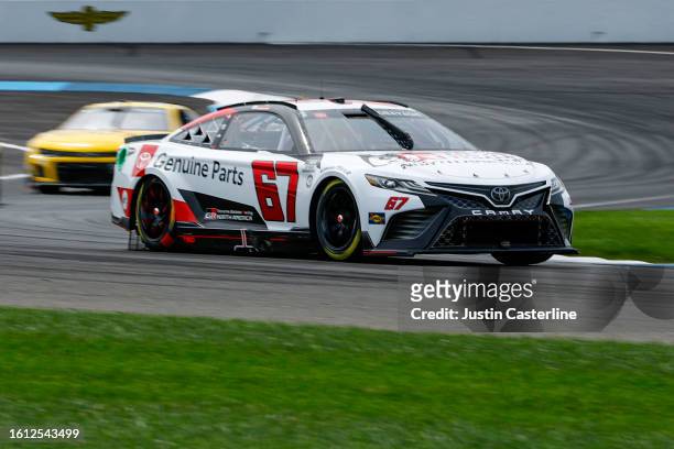 Kamui Kobayashi, driver of the Toyota Genuine Parts Toyota, drives during the NASCAR Cup Series Verizon 200 at the Brickyard at Indianapolis Motor...