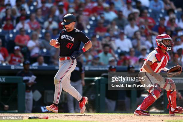 Edouard Julien of the Minnesota Twins scores a run during the ninth inning against the Philadelphia Phillies at Citizens Bank Park on August 13, 2023...