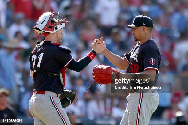 Ryan Jeffers and Jhoan Duran of the Minnesota Twins react after defeating the Philadelphia Phillies at Citizens Bank Park on August 13, 2023 in...
