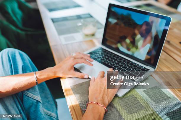 unrecognizable woman hands typing on laptop keyboard, surfing net and watching movies at home. view from above - unrecognizable person stock pictures, royalty-free photos & images