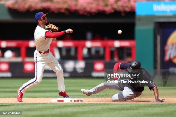 Trea Turner of the Philadelphia Phillies forces out Michael A. Taylor of the Minnesota Twins during the fifth inning at Citizens Bank Park on August...
