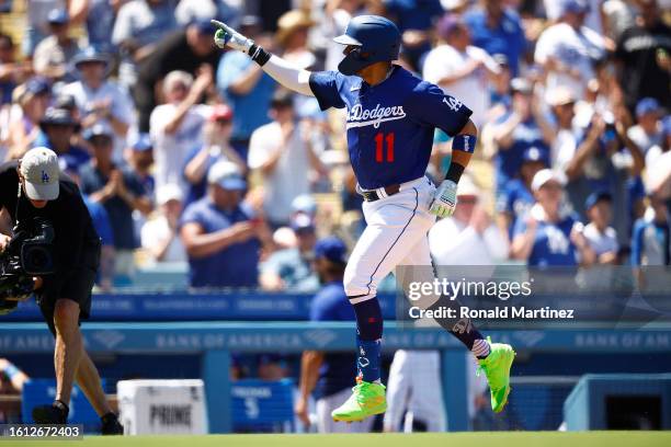 Miguel Rojas of the Los Angeles Dodgers celebrates a home run against the Colorado Rockies in the fourth inning at Dodger Stadium on August 13, 2023...