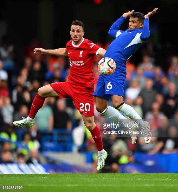 Diogo Jota of Liverpool and Thiago Silva of Chelsea battle for possession during the Premier League match between Chelsea FC and Liverpool FC at...
