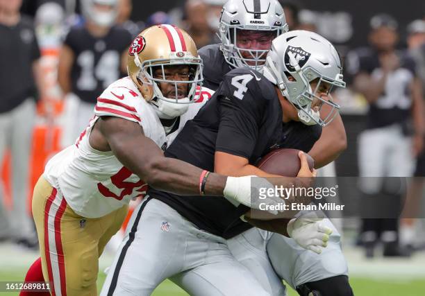 Defensive end Clelin Ferrell of the San Francisco 49ers sacks quarterback Aidan O'Connell of the Las Vegas Raiders in the first quarter of a...