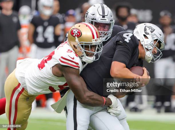 Defensive end Clelin Ferrell of the San Francisco 49ers sacks quarterback Aidan O'Connell of the Las Vegas Raiders in the first quarter of a...
