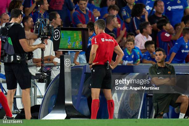 Referee Cesar Soto Grado checks the VAR monitor during the LaLiga EA Sports match between Getafe CF and FC Barcelona at Coliseum Alfonso Perez on...