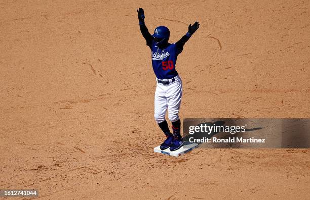 Mookie Betts of the Los Angeles Dodgers after hitting a two-run double against the Colorado Rockies in the sixth inning at Dodger Stadium on August...