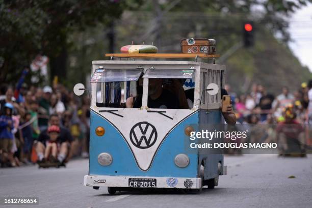 Soapbox cart riders race downhill during the 10th edition of the Rolima do Abacate event during the Virada Cultural festival in Belo Horizonte, state...