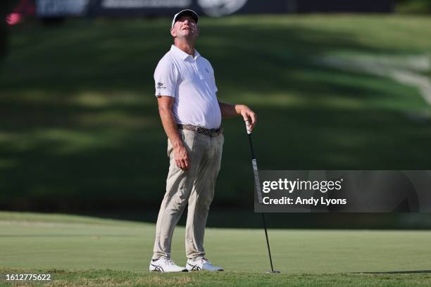 Lucas Glover of the United States reacts to his putt on the 11th green during the final round of the FedEx St. Jude Championship at TPC Southwind on...