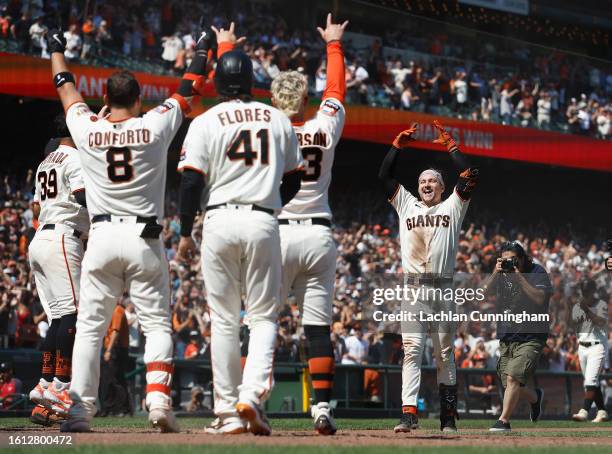 Patrick Bailey of the San Francisco Giants celebrates after hitting a two-run walk-off home run in the bottom of the tenth inning against the Texas...