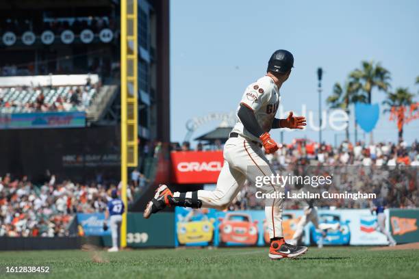 Patrick Bailey of the San Francisco Giants watches the ball after hitting a two-run walk-off home run in the bottom of the tenth inning against the...