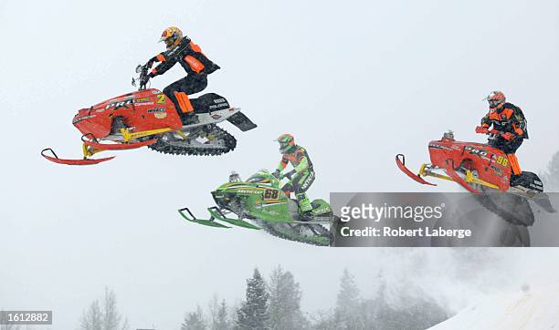 Nathan Titus, second overall, Tucker Hibbert, and Carl Schubitzke compete in the Snowcross event at the Winter X Games in Aspen, Colorado. DIGITAL...