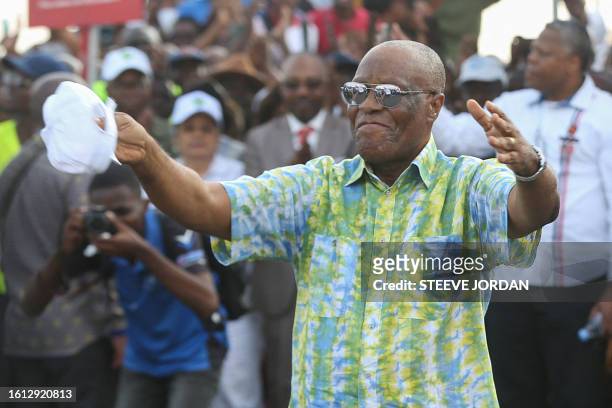 Albert Ondo Ossa, the leader of Gabon's main opposition coalition Alternance 2023, dances during a campaign meeting in Libreville on August 20, 2023....
