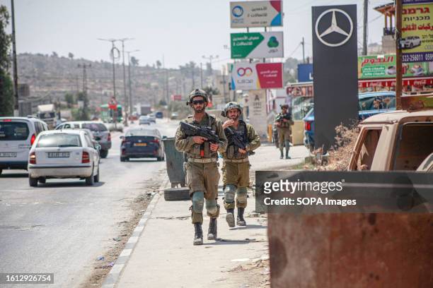 Israeli army forces intensify their presence in the town of Hawara and the surrounding villages, near the shooting site of two Israeli settlers...