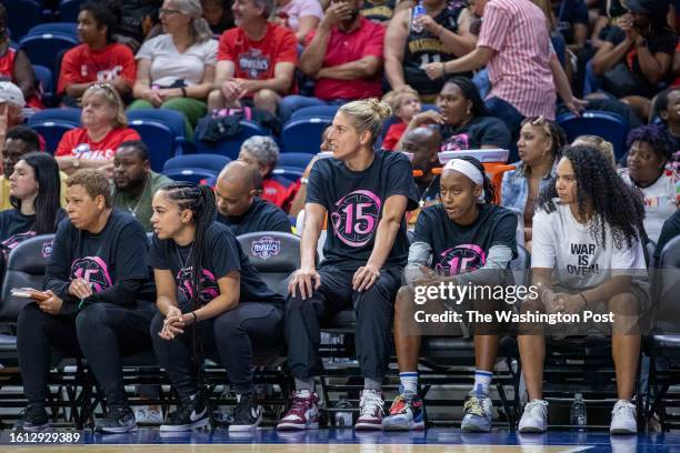 Mystics players, including Elena Delle Donne, sit on the bench during a game between the Washington Mystics and the Dallas Wings at Entertainment and...