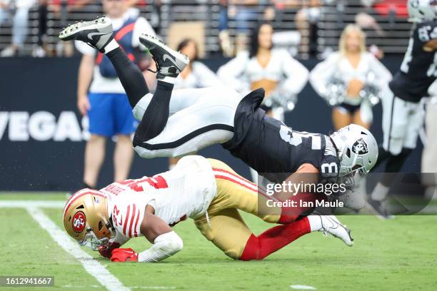 Safety Ji'Ayir Brown of the San Francisco 49ers tackles tight end Cole Fotheringham of the Las Vegas Raiders during the second quarter during a...