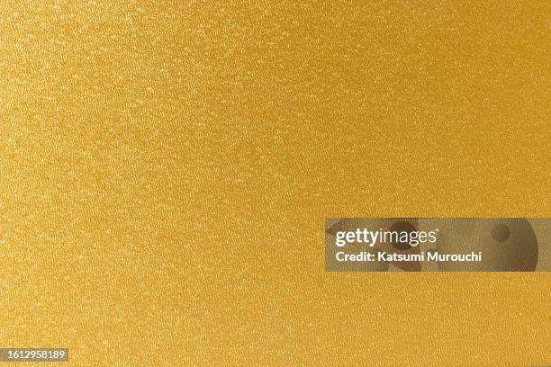 patterned gold paper surface texture background - gold plate stock pictures, royalty-free photos & images
