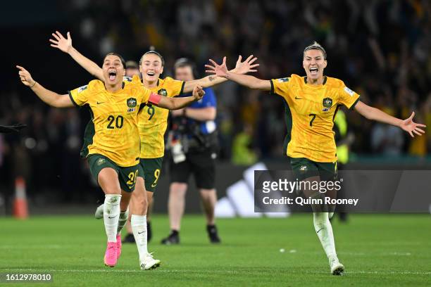 Sam Kerr, Caitlin Foord and Steph Catley of Australia celebrate the team’s victory through the penalty shoot out following the FIFA Women's World Cup...