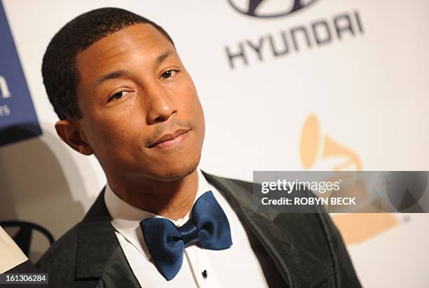 Pharrell Williams arrive for the Clive Davis & The Recording Academy's 2013 Pre-Grammy Gala And Salute To Industry Icons in Beverly Hills,...